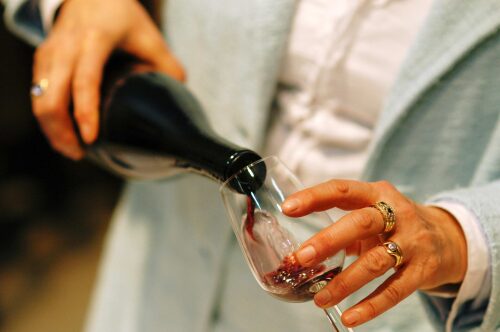 Wine being poured into a glass